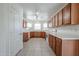 Kitchen boasts granite countertops, tiled floor, and plenty of cabinet space at 28604 N 21St Ln, Phoenix, AZ 85085