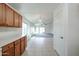 Updated kitchen with solid surface countertops and warm wood cabinets at 28604 N 21St Ln, Phoenix, AZ 85085