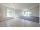 Bright living area with tile, neutral colors, and large window at 28604 N 21St Ln, Phoenix, AZ 85085