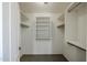 Walk-in closet with built-in shelving and ample storage space at 28604 N 21St Ln, Phoenix, AZ 85085