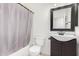 Cozy bathroom featuring a vanity with cabinet, a toilet, and a shower with curtain at 34924 N 30Th Ave, Phoenix, AZ 85086