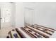 Bright bedroom with a mirrored closet and a colorful blanket at 34924 N 30Th Ave, Phoenix, AZ 85086