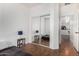 Bedroom with hardwood floors and mirrored closet doors that maximize space and light at 34924 N 30Th Ave, Phoenix, AZ 85086