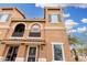 Stunning front view of the home showcasing the architectural details and the red tile roof at 34924 N 30Th Ave, Phoenix, AZ 85086