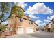 A bright daytime shot shows the home's exterior from the parking area at 34924 N 30Th Ave, Phoenix, AZ 85086