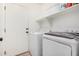 Bright laundry room equipped with a white washer and dryer at 34924 N 30Th Ave, Phoenix, AZ 85086