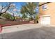 Wide angle shot shows the parking area and home exterior at 34924 N 30Th Ave, Phoenix, AZ 85086