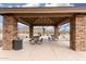 Outdoor pavilion featuring stone pillars, picnic tables, and lounge chairs, perfect for gatherings and relaxation at 34924 N 30Th Ave, Phoenix, AZ 85086
