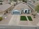 Overhead view of a home featuring a well-manicured yard, neat landscaping, and a spacious driveway at 35282 N Shorthorn Trl, San Tan Valley, AZ 85143