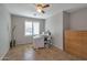 Bedroom featuring a sewing station, neutral walls, window, and wood dresser at 35282 N Shorthorn Trl, San Tan Valley, AZ 85143
