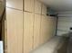 Organized garage featuring built-in cabinets providing ample storage space and easy organization at 35282 N Shorthorn Trl, San Tan Valley, AZ 85143