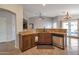 Functional kitchen showcasing a sink, stainless steel dishwasher and dark wood cabinetry at 35282 N Shorthorn Trl, San Tan Valley, AZ 85143