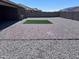 Expansive backyard showcasing a paver patio, gravel landscaping, and a patch of artificial grass at 3829 N Princeton Ln, Casa Grande, AZ 85122