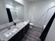 Bathroom featuring double vanity sinks, granite countertops and a shower-tub combo at 3829 N Princeton Ln, Casa Grande, AZ 85122
