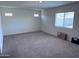 Carpeted bedroom filled with natural light from the window, creating a bright space at 3829 N Princeton Ln, Casa Grande, AZ 85122