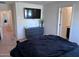 Relaxing bedroom with a large TV, dresser, and serene atmosphere at 3829 N Princeton Ln, Casa Grande, AZ 85122