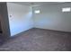 Carpeted room featuring neutral walls with small windows providing natural light at 3829 N Princeton Ln, Casa Grande, AZ 85122