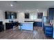 Modern kitchen featuring dark cabinetry, granite countertops, and stainless steel appliances at 3829 N Princeton Ln, Casa Grande, AZ 85122