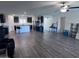 Open-concept living area connected to the kitchen, features wood floors and natural light at 3829 N Princeton Ln, Casa Grande, AZ 85122