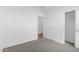 Clean bedroom with light gray carpet and an open door leading into the closet at 3889 S 233Rd Ln, Buckeye, AZ 85326