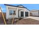 Modern single-Gathering home with a spacious two-car garage and tidy desert landscaping at 3889 S 233Rd Ln, Buckeye, AZ 85326