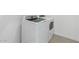 This laundry room features a modern washing machine and dryer with neutral tile floor at 3889 S 233Rd Ln, Buckeye, AZ 85326