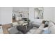 Bright, modern living room featuring an open floor plan and contemporary decor at 3889 S 233Rd Ln, Buckeye, AZ 85326
