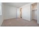 Bedroom with carpet, window, and closet with a door to the bathroom at 40113 N Alameda Dr, San Tan Valley, AZ 85140