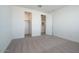 Bright bedroom with carpet, closet, and a door to the bathroom at 40113 N Alameda Dr, San Tan Valley, AZ 85140