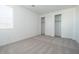 Sunlit bedroom with neutral carpet and closet with sliding doors at 40113 N Alameda Dr, San Tan Valley, AZ 85140