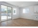 Bright living room showcases tile floors and sliding glass door to the backyard at 40113 N Alameda Dr, San Tan Valley, AZ 85140