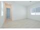 Bright bedroom features neutral walls, tile flooring and a window that offers natural light at 40129 N Alameda Dr, San Tan Valley, AZ 85140