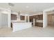 Open-concept kitchen with modern appliances, a large island, and ample cabinet space at 40129 N Alameda Dr, San Tan Valley, AZ 85140
