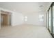 Spacious living room with neutral walls, tile flooring, and recessed lighting fixtures at 40129 N Alameda Dr, San Tan Valley, AZ 85140