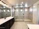 Modern bathroom featuring a glass shower with tile surround and built-in seat at 40147 N Alameda Dr, San Tan Valley, AZ 85140