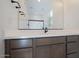 Elegant bathroom features a spacious vanity with a modern sink and sleek fixtures, complemented by a large mirror at 40147 N Alameda Dr, San Tan Valley, AZ 85140