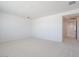 Bright bedroom with neutral carpeting and access to a hallway, offering a clean and inviting space at 40147 N Alameda Dr, San Tan Valley, AZ 85140