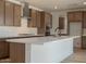 Open kitchen with large island, stainless steel appliances, and modern cabinetry at 40147 N Alameda Dr, San Tan Valley, AZ 85140