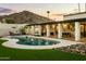 Inviting backyard featuring a sparkling pool, spacious patio, and picturesque mountain views at 4625 E Mountain View Rd, Phoenix, AZ 85028