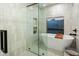 Chic bathroom showcases an elegant standalone tub next to a window, complemented by a glass-enclosed shower at 4625 E Mountain View Rd, Phoenix, AZ 85028
