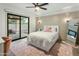 Cozy bedroom featuring a plush rug, a comfortable bed, and a sliding glass door to the outdoor patio at 4625 E Mountain View Rd, Phoenix, AZ 85028