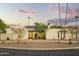 Beautiful modern home with manicured desert landscaping and a circular driveway at 4625 E Mountain View Rd, Phoenix, AZ 85028