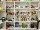 Organized pantry with multiple shelves stocked with groceries and household items at 4625 E Mountain View Rd, Phoenix, AZ 85028