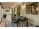 Relaxing patio area with an outdoor dining set and view of the kitchen window at 4625 E Mountain View Rd, Phoenix, AZ 85028
