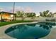 Sparkling pool surrounded by lush landscaping, lounge area, and cabana for ultimate relaxation and entertainment at 4625 E Mountain View Rd, Phoenix, AZ 85028