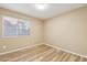 Cozy bedroom with light-filled window and modern, wood-look flooring at 4693 W Tara Dr, Chandler, AZ 85226