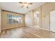 Serene main bedroom with wood floors, a ceiling fan, and an ensuite bathroom at 4693 W Tara Dr, Chandler, AZ 85226