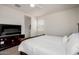 Spacious bedroom with ceiling fan and TV stand at 5101 E Sharbel Rd, San Tan Valley, AZ 85143