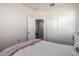 Neutral bedroom featuring plush carpet and a comfortable bed with a white comforter at 5101 E Sharbel Rd, San Tan Valley, AZ 85143