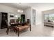 Elegant dining room features a dark wood table, stylish chairs, and a decorative mirror at 5101 E Sharbel Rd, San Tan Valley, AZ 85143